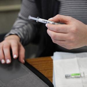 US medical groups urge people to get flu and Covid shots in counter to Trump guidance