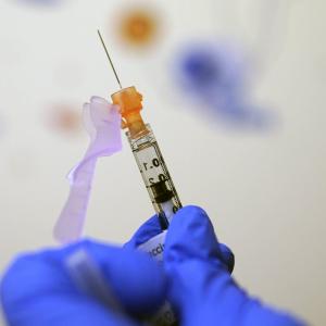 The economics of flu, measles and COVID vaccination