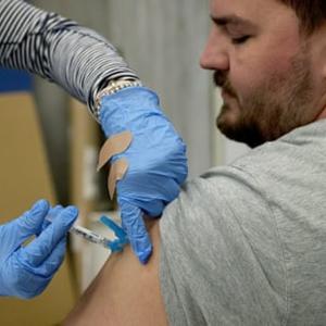 US insurers' move to back vaccines sends 'powerful' message about safety of shots, experts say