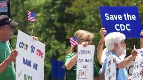 CDC staff and retired workers call for Kennedy's resignation in a protest outside headquarters