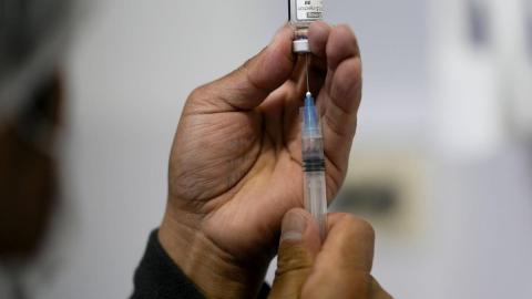 Alberta doctors say province's attempt to save on COVID shots could cost more