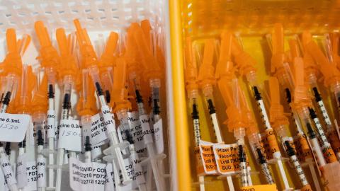 F.D.A. Official Overruled Scientists on Wide Access to Covid Shots