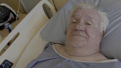 Man stuck in B.C. hospital bed after fire at long-term care home. Who's responsible for where he goes next?