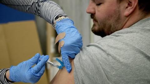 US insurers' move to back vaccines sends 'powerful' message about safety of shots, experts say